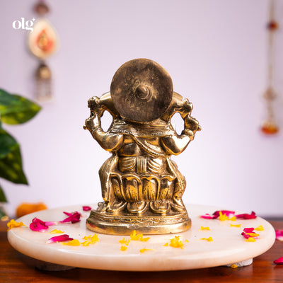 Antique brass Ganesha idol seated on lotus base, 7 inch, handcrafted