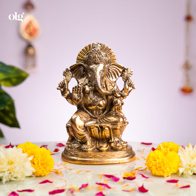 Antique brass Ganesha idol seated on lotus base, 7 inch, handcrafted