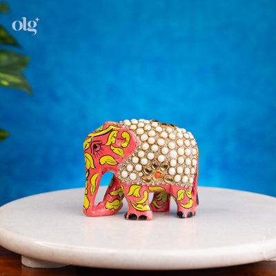 Hand-painted wooden elephant figurine with pearl work detailing