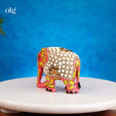 Hand-painted wooden elephant figurine with pearl work detailing