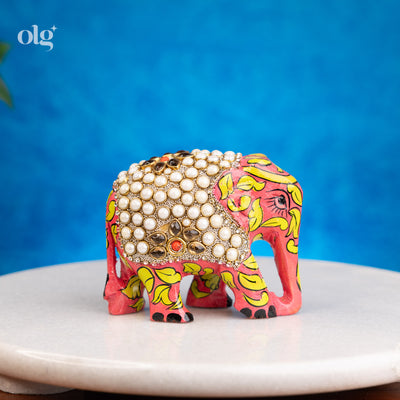 Hand-painted wooden elephant figurine with pearl work detailing