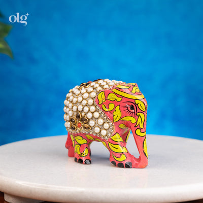 Hand-painted wooden elephant figurine with pearl work detailing