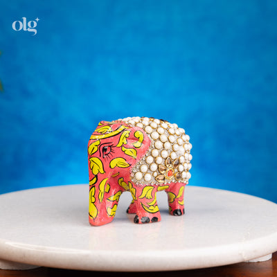 Hand-painted wooden elephant figurine with pearl work detailing