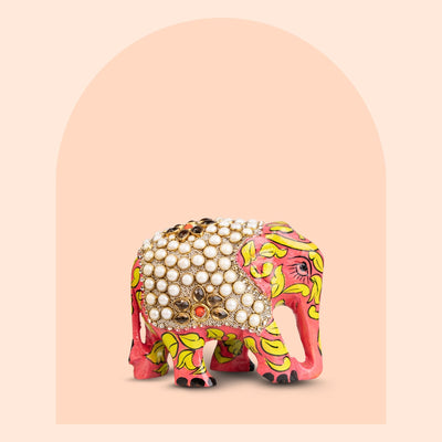 Hand-painted wooden elephant figurine with pearl work detailing