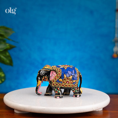 Hand-painted black and blue wooden elephant figurine with mosaic inlay
