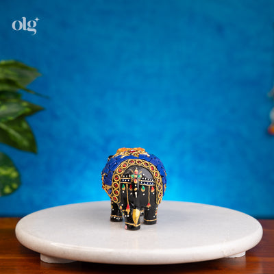 Hand-painted black and blue wooden elephant figurine with mosaic inlay