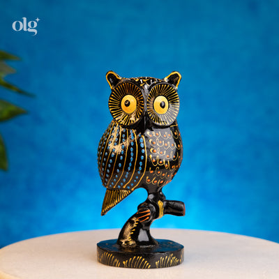 Hand-painted black and gold kadam wood owl figurine on branch, 6 inch