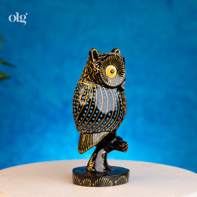 Hand-painted black and gold kadam wood owl figurine on branch, 6 inch