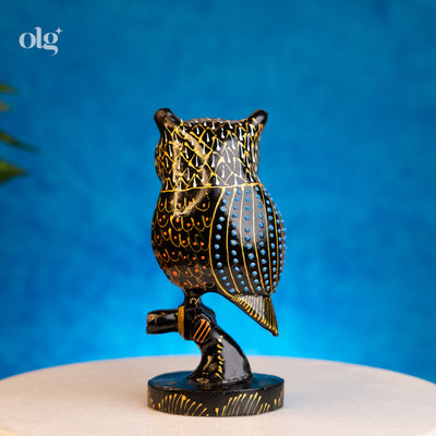 Hand-painted black and gold kadam wood owl figurine on branch, 6 inch