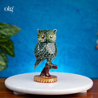 Hand-painted dark green kadam wood owl figurine on branch