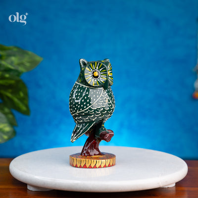 Hand-painted dark green kadam wood owl figurine on branch