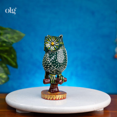 Hand-painted dark green kadam wood owl figurine on branch