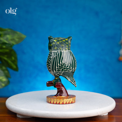 Hand-painted dark green kadam wood owl figurine on branch