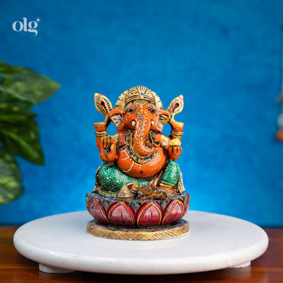 Hand-painted orange and green kadam wood Ganesha idol