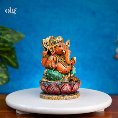 Hand-painted orange and green kadam wood Ganesha idol