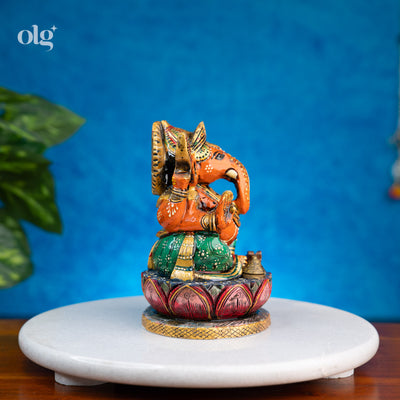 Hand-painted orange and green kadam wood Ganesha idol