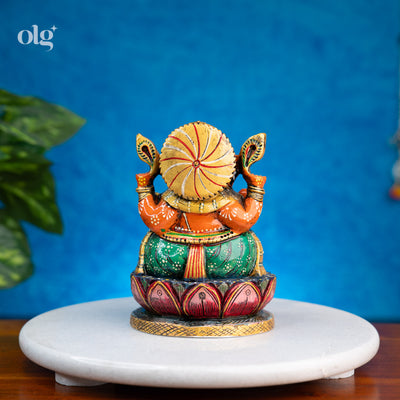 Hand-painted orange and green kadam wood Ganesha idol
