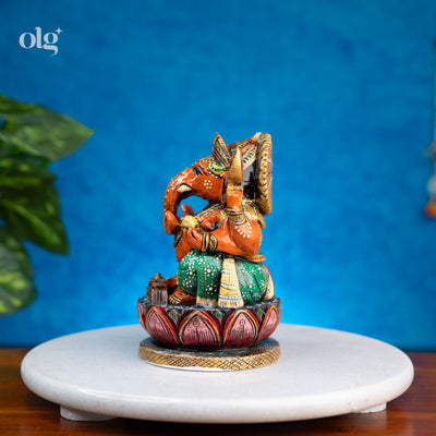Hand-painted orange and green kadam wood Ganesha idol