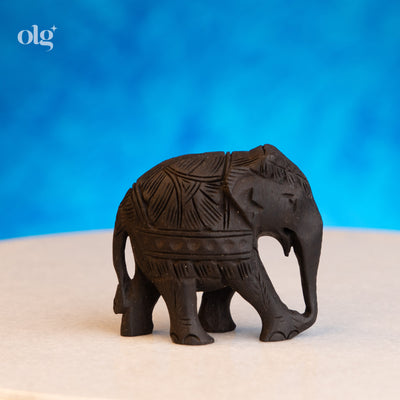 Hand-carved dark wood elephant figurine, 2 inch, plain natural finish