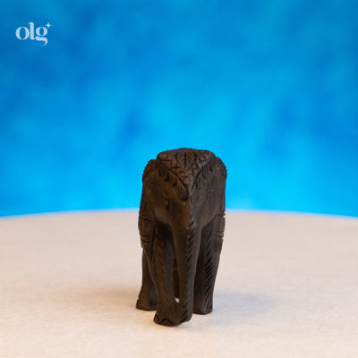 Hand-carved dark wood elephant figurine, 2 inch, plain natural finish