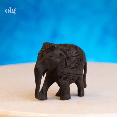 Hand-carved dark wood elephant figurine, 2 inch, plain natural finish