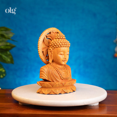 Hand-carved wooden Buddha bust with carved halo