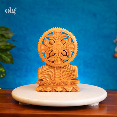 Hand-carved wooden Buddha bust with carved halo