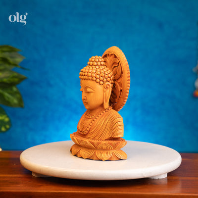 Hand-carved wooden Buddha bust with carved halo