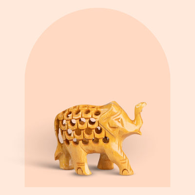 Miniature hand-carved wooden elephant figurine with jali work, 2 inch