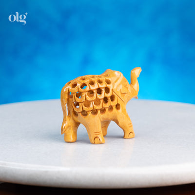Miniature hand-carved wooden elephant figurine with jali work, 2 inch