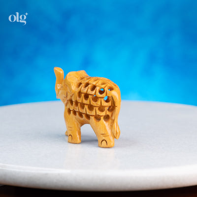 Miniature hand-carved wooden elephant figurine with jali work, 2 inch