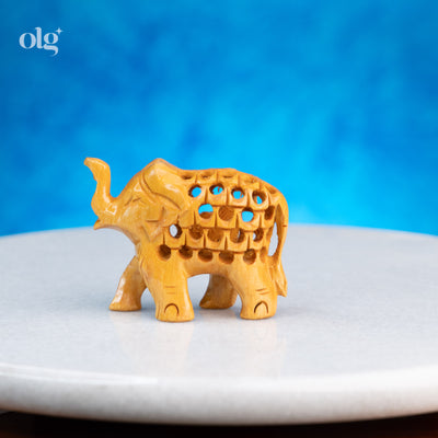 Miniature hand-carved wooden elephant figurine with jali work, 2 inch