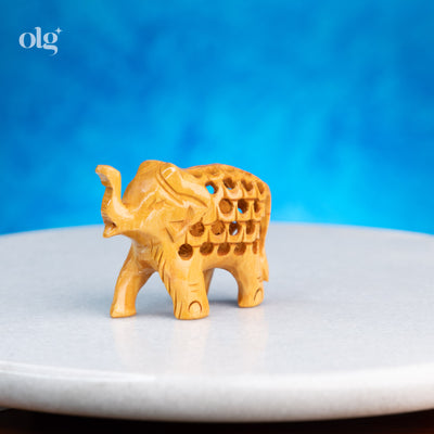 Miniature hand-carved wooden elephant figurine with jali work, 2 inch