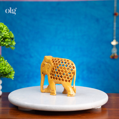 Hand-carved wooden elephant figurine with jali lattice design, 4 inch