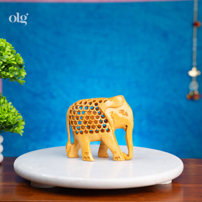 Hand-carved wooden elephant figurine with jali lattice design, 4 inch