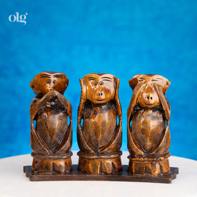 Hand-carved dark brown wooden Three Wise Monkeys statue