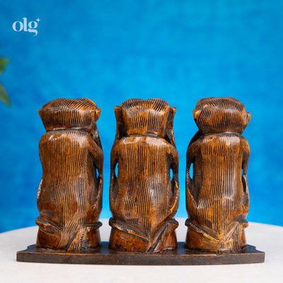 Hand-carved dark brown wooden Three Wise Monkeys statue