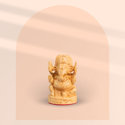 Miniature hand-carved wooden Lord Ganesha idol