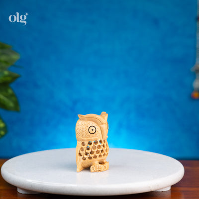 Miniature hand-carved wooden owl figurine with jali lattice work