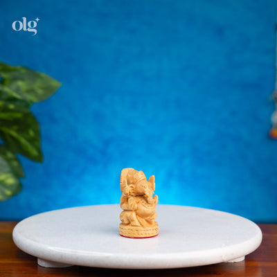 Miniature hand-carved wooden Lord Ganesha idol