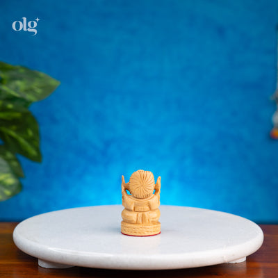 Miniature hand-carved wooden Lord Ganesha idol