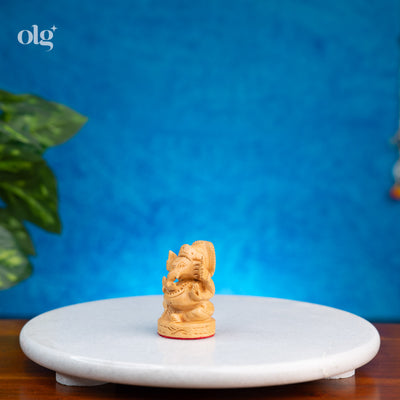Miniature hand-carved wooden Lord Ganesha idol