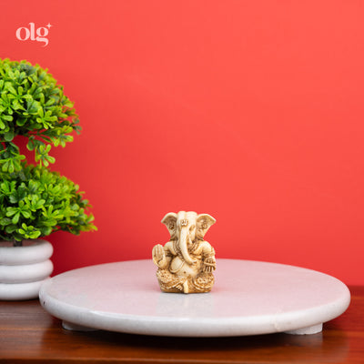 Pocket-sized cultured marble Ganesh figurine, antique ivory finish