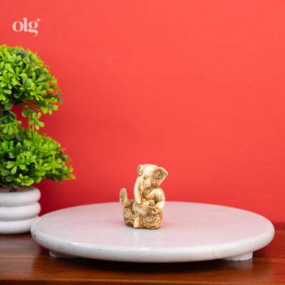 Pocket-sized cultured marble Ganesh figurine, antique ivory finish