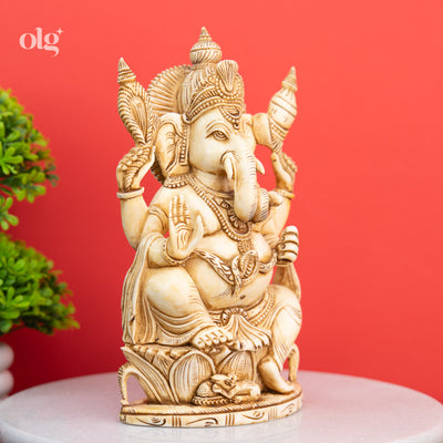 Cultured marble seated Ganesha statue, antique ivory finish