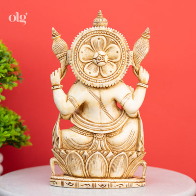 Cultured marble seated Ganesha statue, antique ivory finish