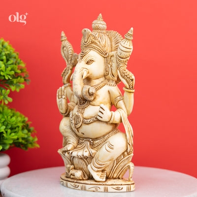 Cultured marble seated Ganesha statue, antique ivory finish