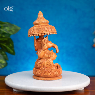 Hand-carved wooden Ganesha statue with chhatri canopy, 8 inch