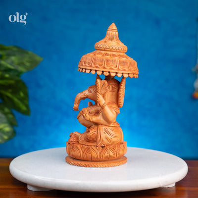 Hand-carved wooden Ganesha statue with chhatri canopy, 8 inch