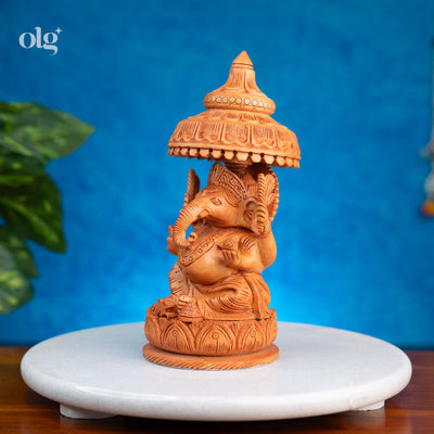 Hand-carved wooden Ganesha statue with chhatri canopy, 8 inch